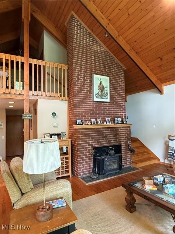 2650 W Buckhorn Dr Unit 823, Millersburg, OH 44654 - living area featuring high vaulted ceiling, wood finished floors, a wood ceiling with exposed beams, and a wood stove