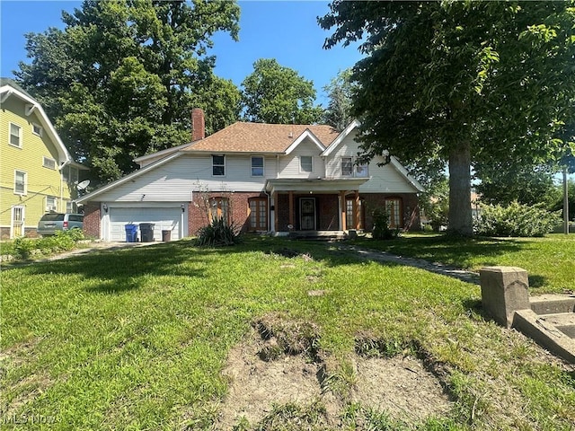 10937 Drexel Ave, Cleveland, OH 44108 - traditional-style house with brick siding, a front yard, a porch, a chimney, and an attached garage