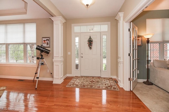 7149 Cascade Creek Ln, Independence, OH 44131 - entrance foyer featuring decorative columns and wood-type flooring