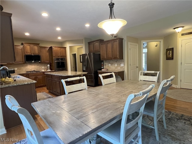 7149 Cascade Creek Ln, Independence, OH 44131 - dining area featuring light wood-style flooring and recessed lighting