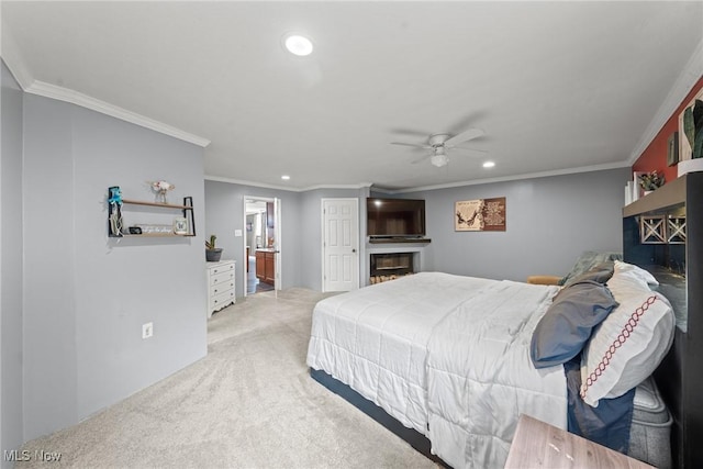 208 Clark St, Berea, OH 44017 - bedroom with a glass covered fireplace, recessed lighting, crown molding, light colored carpet, and connected bathroom