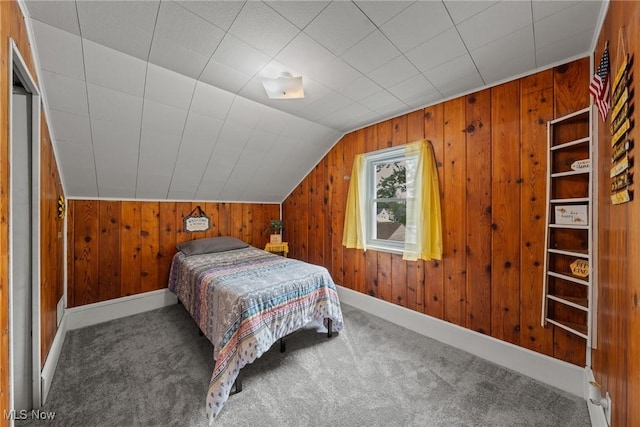 208 Clark St, Berea, OH 44017 - bedroom with carpet flooring, wooden walls, and vaulted ceiling