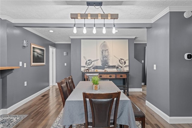208 Clark St, Berea, OH 44017 - dining space with a textured ceiling and wood finished floors