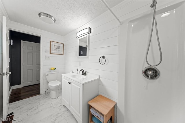 208 Clark St, Berea, OH 44017 - bathroom with a shower, vanity, marble finish flooring, a textured ceiling, and wood walls