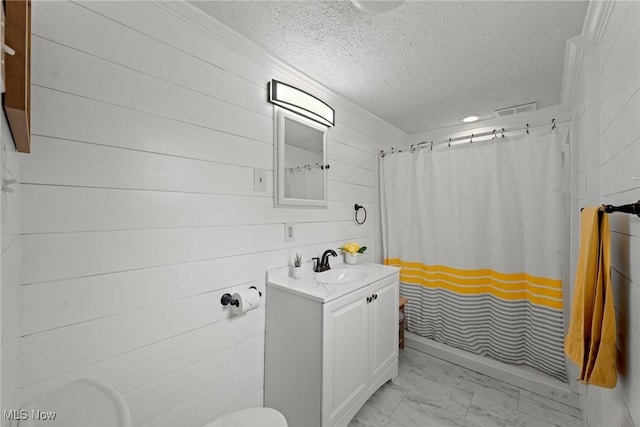 208 Clark St, Berea, OH 44017 - bathroom with marble finish flooring, a textured ceiling, vanity, a shower with shower curtain, and wood walls