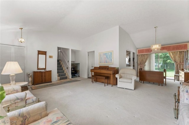 24622 Mitchell Dr, North Olmsted, OH 44070 - living area featuring carpet flooring, vaulted ceiling, stairs, and a chandelier