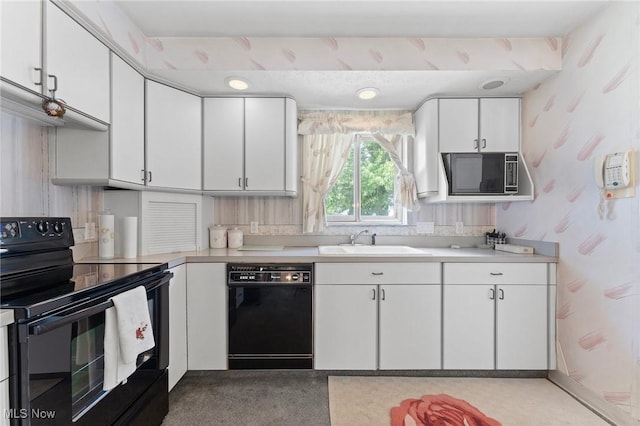 24622 Mitchell Dr, North Olmsted, OH 44070 - kitchen featuring black appliances, wallpapered walls, white cabinets, and light countertops
