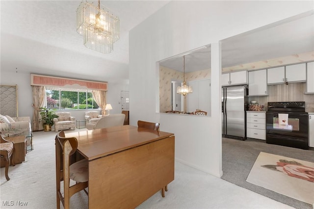 24622 Mitchell Dr, North Olmsted, OH 44070 - dining area featuring a chandelier and light carpet