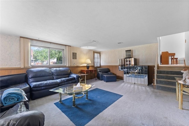 24622 Mitchell Dr, North Olmsted, OH 44070 - carpeted living room with wainscoting and wooden walls