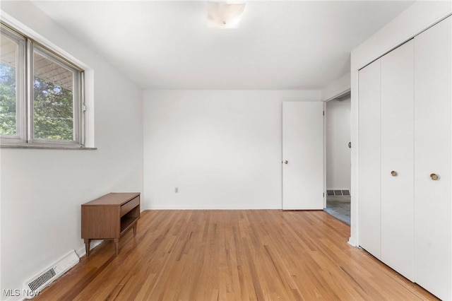 24622 Mitchell Dr, North Olmsted, OH 44070 - unfurnished bedroom featuring light wood-type flooring and a closet
