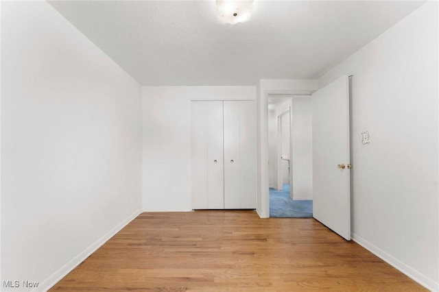 24622 Mitchell Dr, North Olmsted, OH 44070 - unfurnished bedroom featuring light wood-style floors and a closet