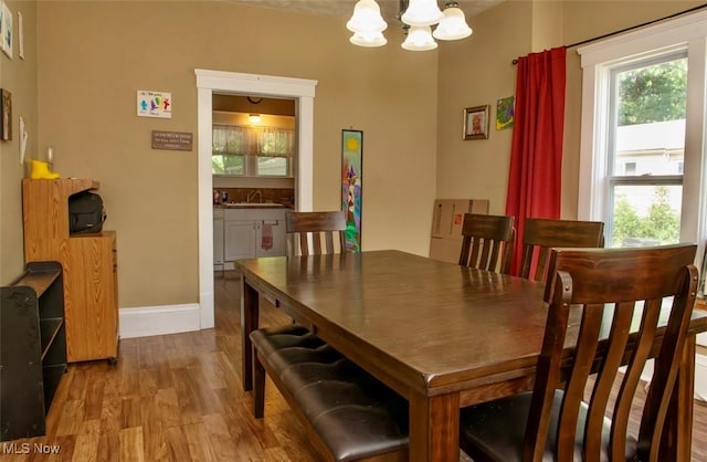 877 W Nimisila Rd, New Franklin, OH 44319 - dining space with a chandelier and wood finished floors