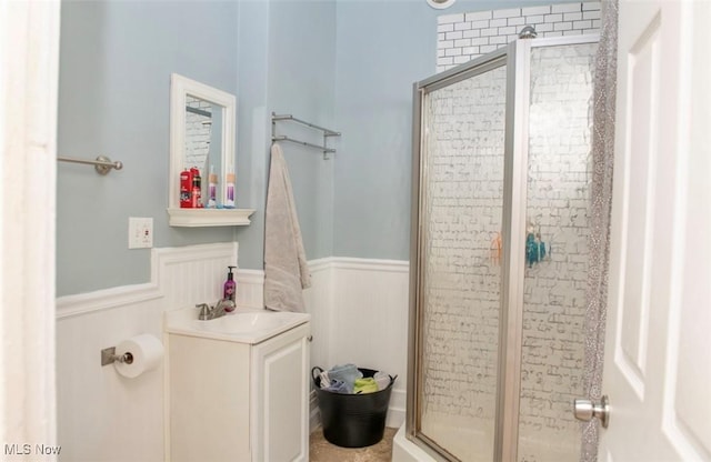 877 W Nimisila Rd, New Franklin, OH 44319 - bathroom with wainscoting, a stall shower, and vanity