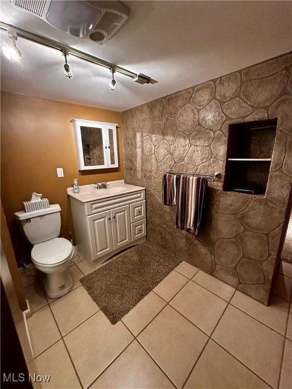 54431 Maple Ln, Martins Ferry, OH 43935 - bathroom with track lighting, vanity, and tile patterned floors