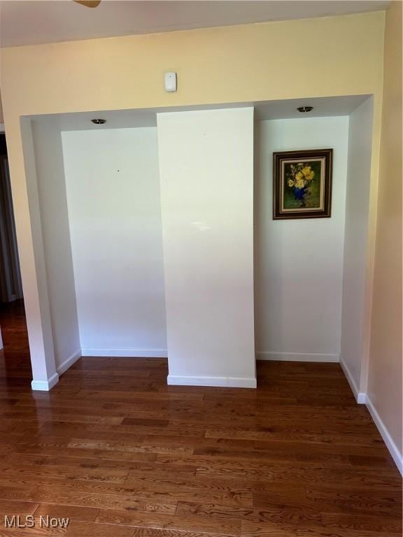54431 Maple Ln, Martins Ferry, OH 43935 - empty room featuring dark wood-type flooring and baseboards