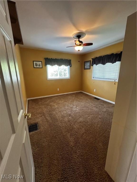 54431 Maple Ln, Martins Ferry, OH 43935 - spare room featuring healthy amount of natural light, ceiling fan, and carpet