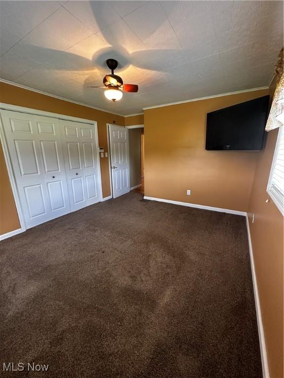 54431 Maple Ln, Martins Ferry, OH 43935 - unfurnished bedroom with ornamental molding, carpet floors, and a ceiling fan