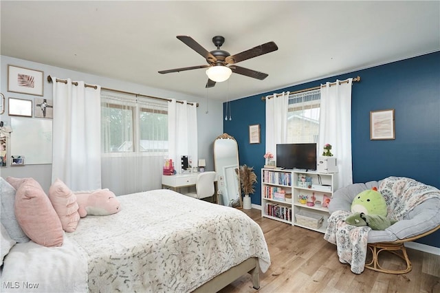661 Wynne Dr, Coventry, OH 44319 - bedroom featuring wood finished floors and ceiling fan