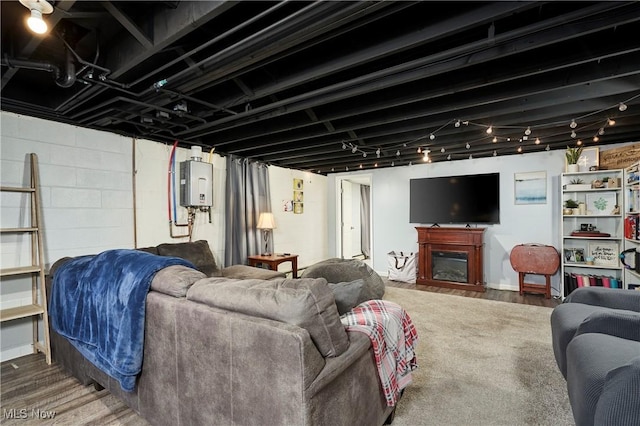 661 Wynne Dr, Coventry, OH 44319 - living room featuring tankless water heater, a fireplace, and wood finished floors