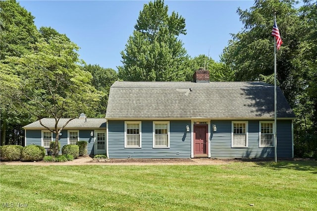 11715 Dunham Rd, Sagamore Hills, OH 44067 - colonial inspired home with a front yard, a chimney, and roof with shingles