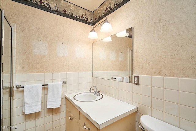 11715 Dunham Rd, Sagamore Hills, OH 44067 - bathroom featuring vanity, wallpapered walls, and tile walls