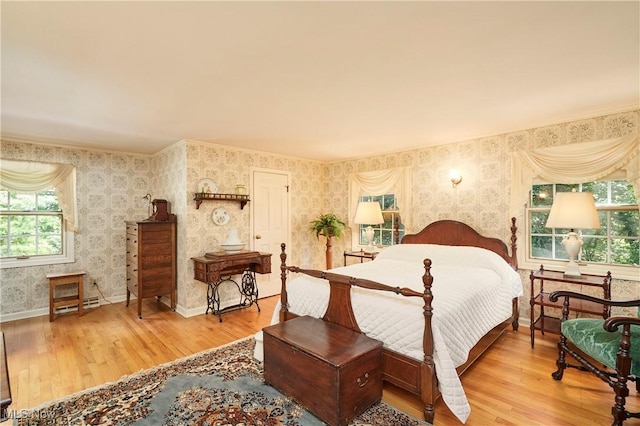 11715 Dunham Rd, Sagamore Hills, OH 44067 - bedroom with wallpapered walls, wood finished floors, and multiple windows