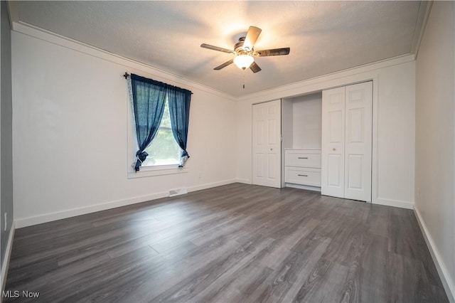 2364 Earl, Niles, OH 44446 - unfurnished bedroom with crown molding, dark wood-style floors, a closet, and a ceiling fan