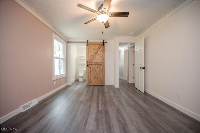 2364 Earl, Niles, OH 44446 - unfurnished bedroom featuring a barn door, crown molding, dark wood finished floors, and a ceiling fan