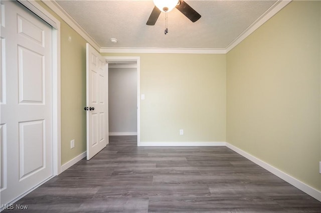 2364 Earl, Niles, OH 44446 - unfurnished bedroom featuring crown molding, dark wood-style floors, a textured ceiling, and a ceiling fan
