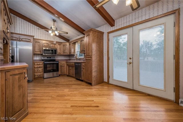 399 Abbyshire Rd, Akron, OH 44319 - kitchen with stainless steel appliances, a ceiling fan, wallpapered walls, french doors, and light wood-style floors