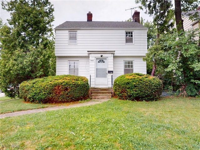3863 Grosvenor Rd, South Euclid, OH 44118 - colonial home with a front lawn, a chimney, and entry steps