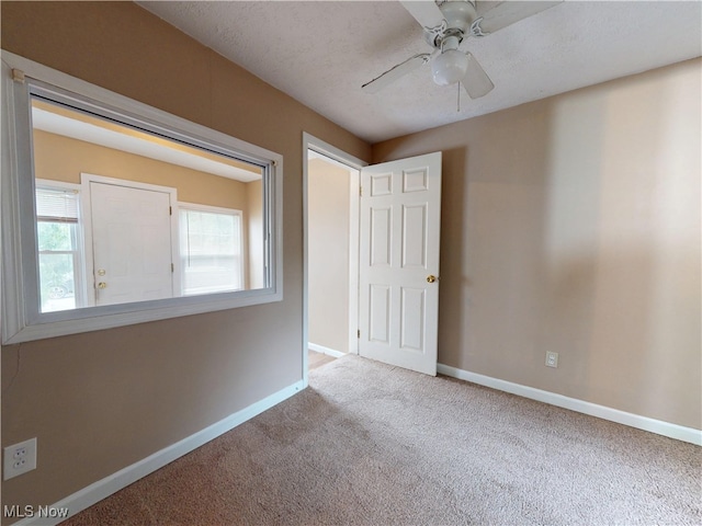 3863 Grosvenor Rd, South Euclid, OH 44118 - carpeted empty room with baseboards and ceiling fan