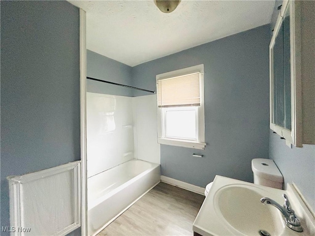 1200 E 125th St, Cleveland, OH 44112 - bathroom with wood finished floors, shower / bathtub combination, and vanity