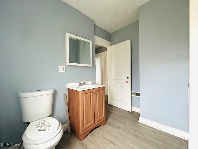1200 E 125th St, Cleveland, OH 44112 - bathroom with vanity and wood finished floors