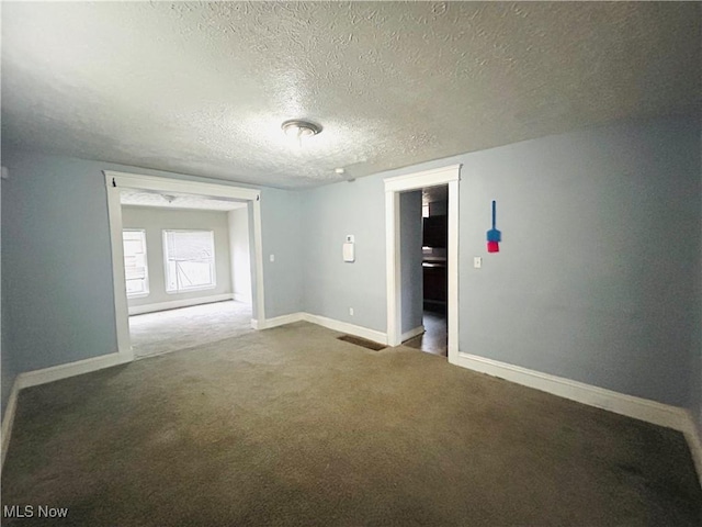 1200 E 125th St, Cleveland, OH 44112 - carpeted spare room featuring a textured ceiling and baseboards
