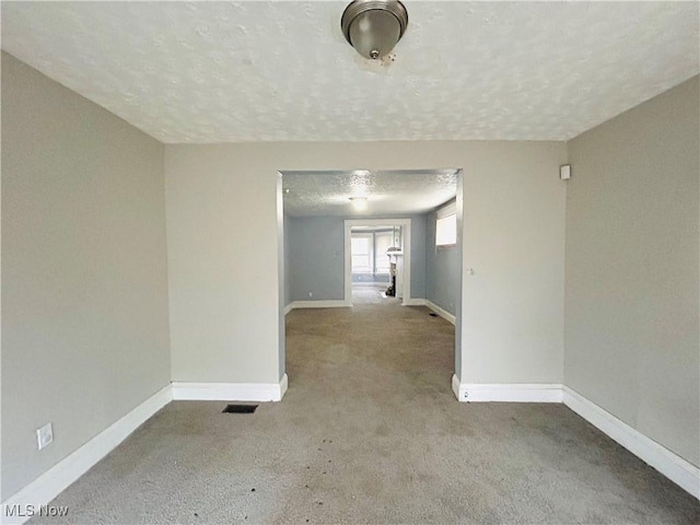 1200 E 125th St, Cleveland, OH 44112 - spare room with carpet and a textured ceiling