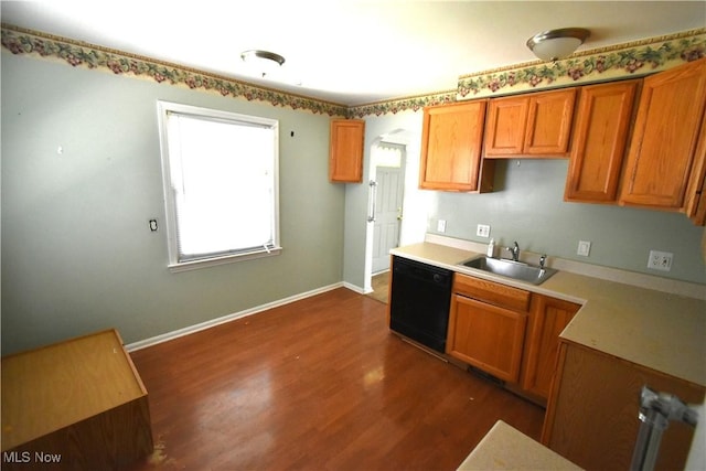 14514 Krems Ave, Maple Heights, OH 44137 - kitchen with dishwasher, dark wood-style floors, light countertops, and brown cabinets