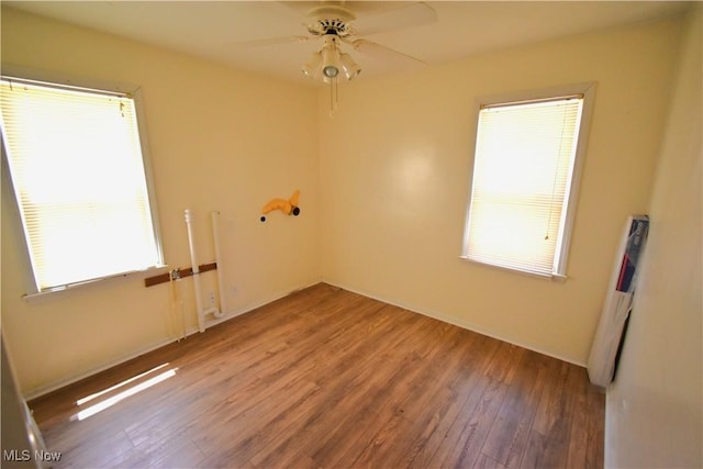 14514 Krems Ave, Maple Heights, OH 44137 - empty room with wood finished floors and a ceiling fan