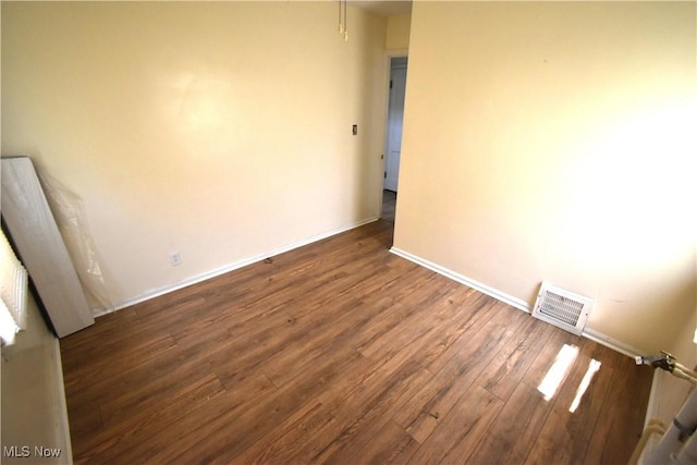14514 Krems Ave, Maple Heights, OH 44137 - empty room with wood finished floors and baseboards