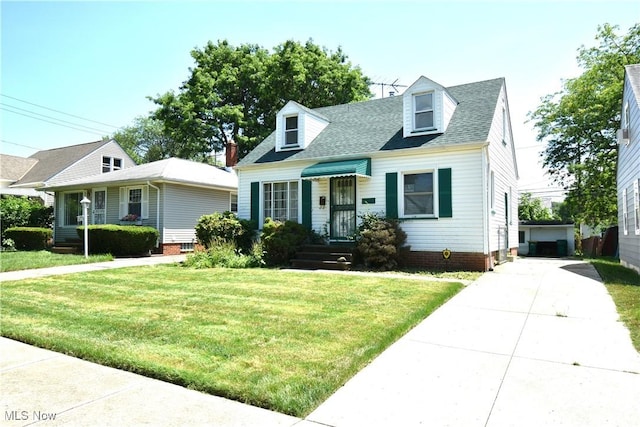 14514 Krems Ave, Maple Heights, OH 44137 - cape cod house with a front lawn and a shingled roof