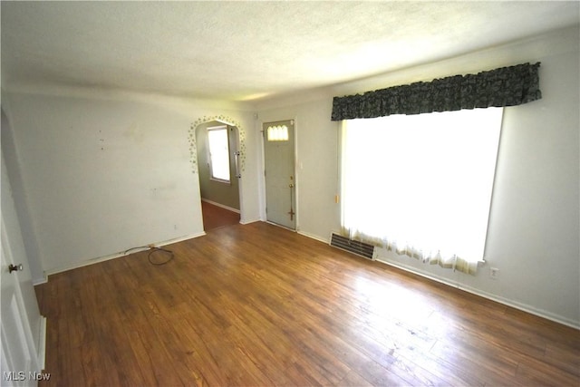 14514 Krems Ave, Maple Heights, OH 44137 - spare room featuring arched walkways and wood finished floors