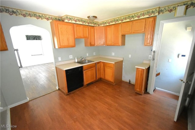 14514 Krems Ave, Maple Heights, OH 44137 - kitchen featuring black dishwasher, wood finished floors, and light countertops