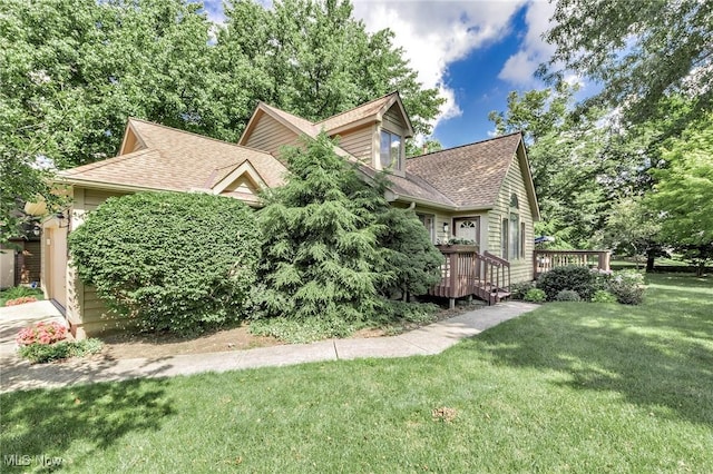 836 Arboretum Cir, Sagamore Hills, OH 44067 - view of side of property featuring roof with shingles, a deck, a yard, and a garage