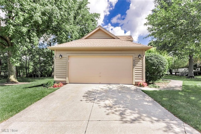 836 Arboretum Cir, Sagamore Hills, OH 44067 - view of front facade with a garage, a front lawn, roof with shingles, and concrete driveway