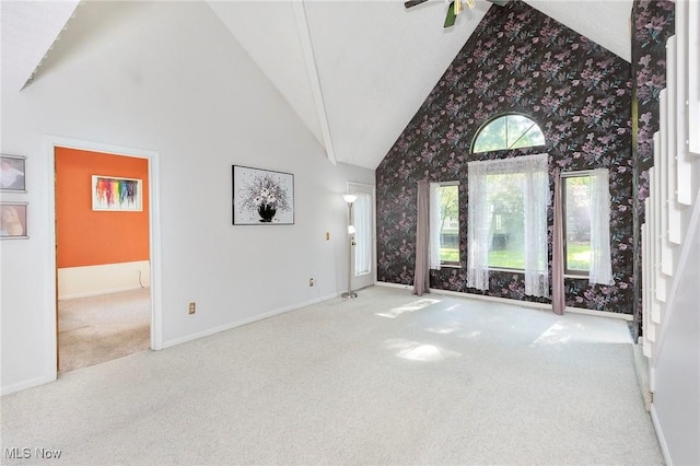 836 Arboretum Cir, Sagamore Hills, OH 44067 - unfurnished living room featuring carpet flooring, wallpapered walls, and high vaulted ceiling