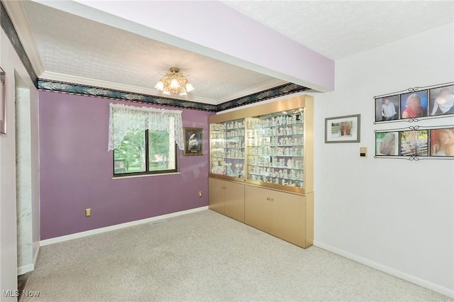836 Arboretum Cir, Sagamore Hills, OH 44067 - carpeted empty room featuring a textured ceiling, crown molding, and a chandelier