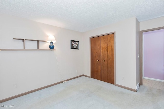 836 Arboretum Cir, Sagamore Hills, OH 44067 - unfurnished bedroom with carpet, a closet, and a textured ceiling