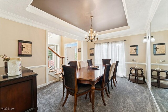 3281 Evans Way, Twinsburg, OH 44087 - dining area with a tray ceiling, a chandelier, ornamental molding, dark carpet, and stairway