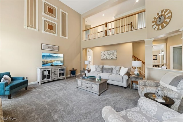 3281 Evans Way, Twinsburg, OH 44087 - living area with a high ceiling, carpet floors, and stairs