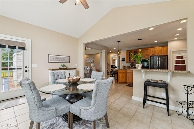 3281 Evans Way, Twinsburg, OH 44087 - dining area featuring light tile patterned flooring, ceiling fan, decorative columns, recessed lighting, and high vaulted ceiling